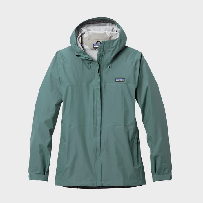 A green hooded rain jacket hangs against a plain white background.
