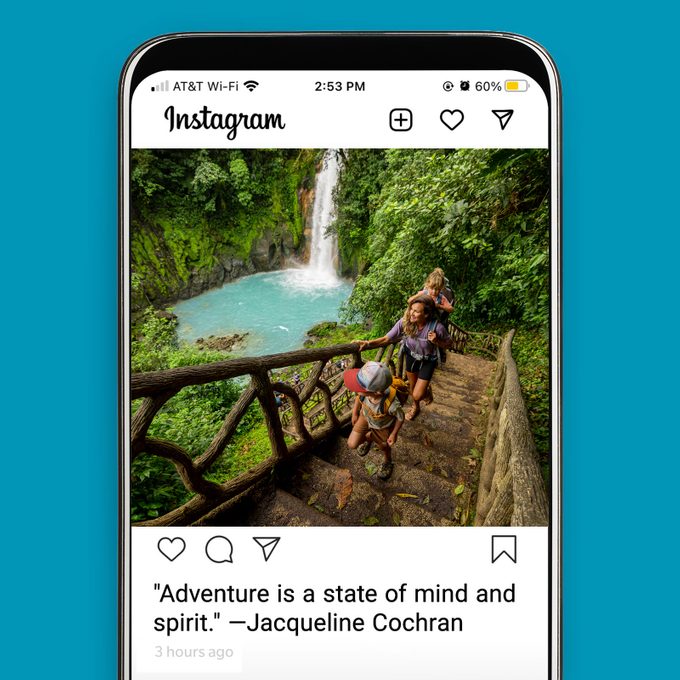 An instagram post showing adventurous travel by family around waterfall and greenery with a travel quote caption
