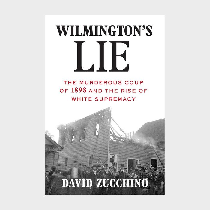 Book cover features a partially burned building with a crowd, highlighting historical themes. Title: 
