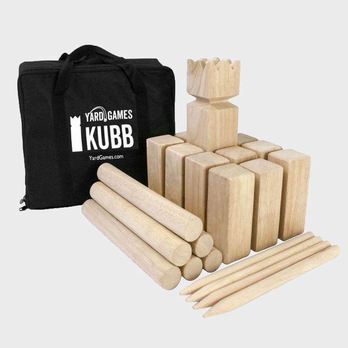 Wooden blocks and cylinders arranged next to a black bag, labeled 