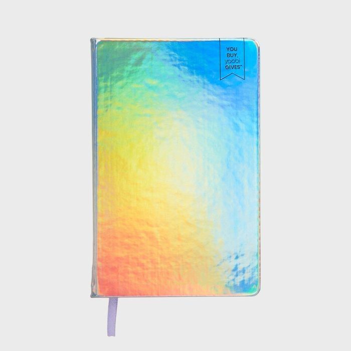 Notebook with iridescent cover, displaying rainbow colors, and a purple ribbon bookmark. The corner has a blue tag reading 