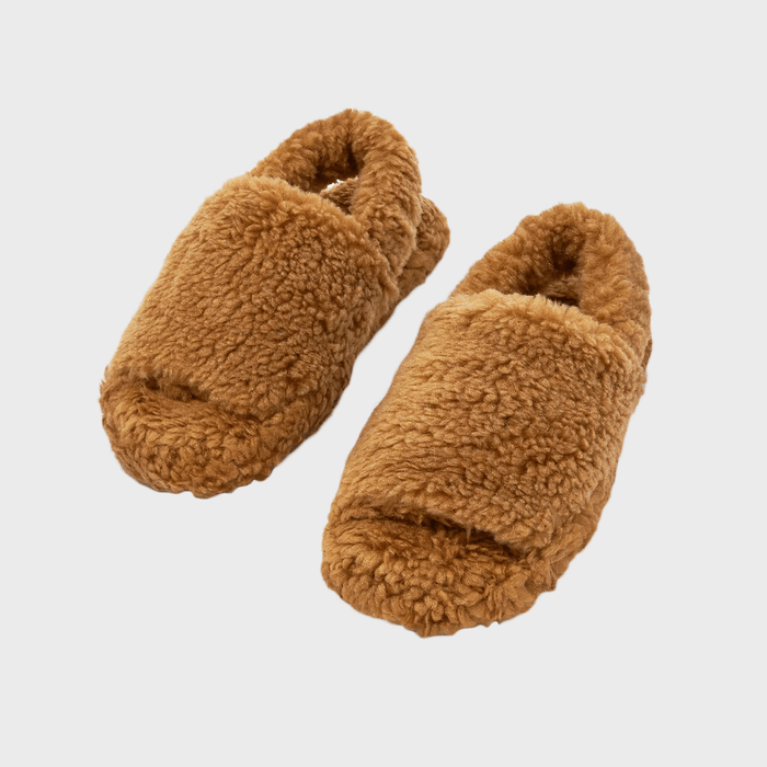 Brown, fluffy slippers resting together on a plain white background, appearing cozy and inviting for indoor wear.