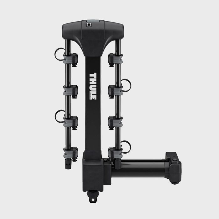 Black bike rack stands, equipped with multiple clamps, designed for vehicle attachment; features brand name 