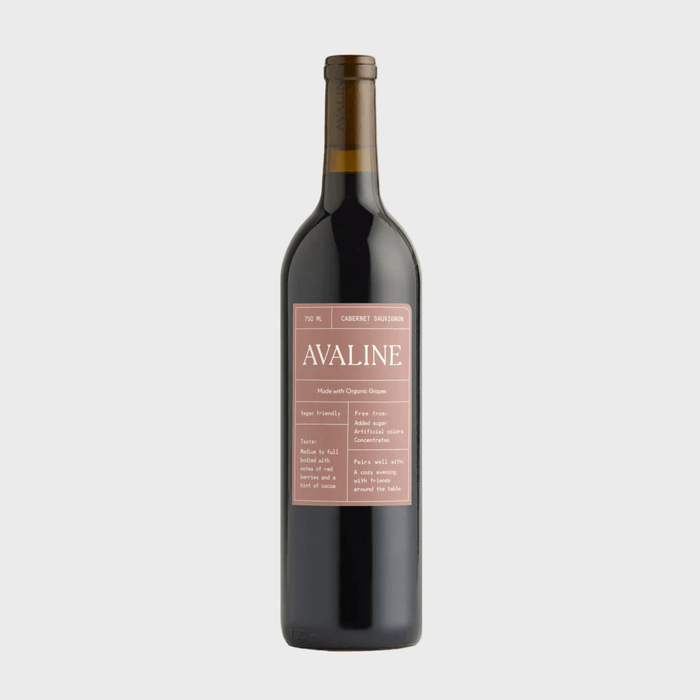 A wine bottle stands against a white background; the label reads 