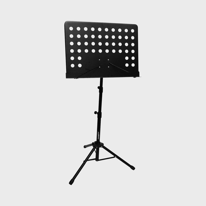 Music stand holds sheet music, features adjustable height, and perforated design; stands on a three-leg base in a simple, clear background.