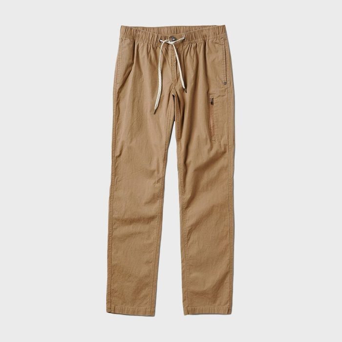 Khaki pants lie flat, featuring an elastic waistband with a drawstring and a side zip pocket, set against a plain white background.