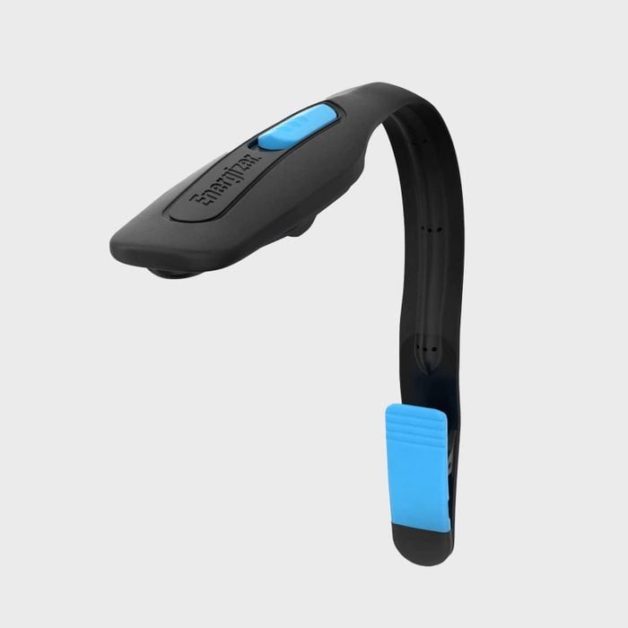 A black book light with a flexible arm and blue accents rests against a plain gray background.