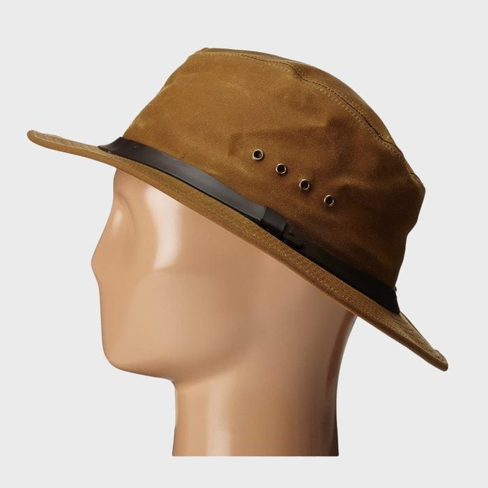 Brown fedora with a black band sits on a mannequin head, viewed in profile, against a plain gray background.