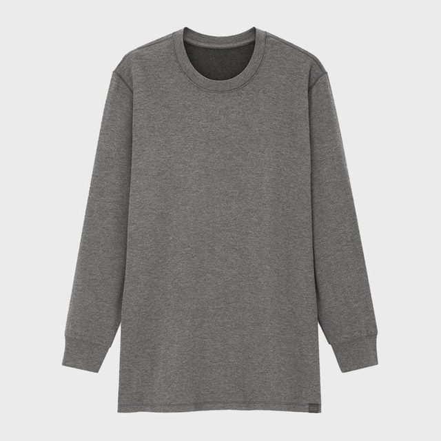 Grey long-sleeve t-shirt hangs against a plain white background, showcasing its simple, casual design.