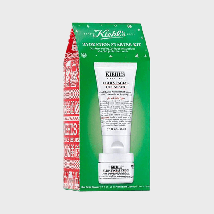 Box contains Kiehlâ€™s Ultra Facial Cleanser and Ultra Facial Cream, presented in green and red holiday-themed packaging with text detailing product features.