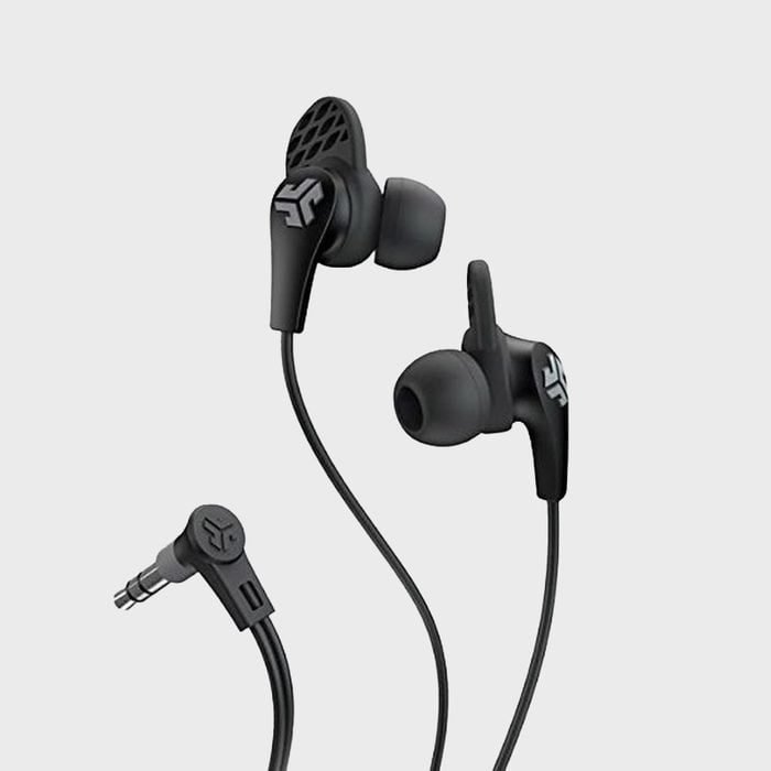 Black earbuds with logo rest beside angled plug, connected by wires, against a plain gray background.