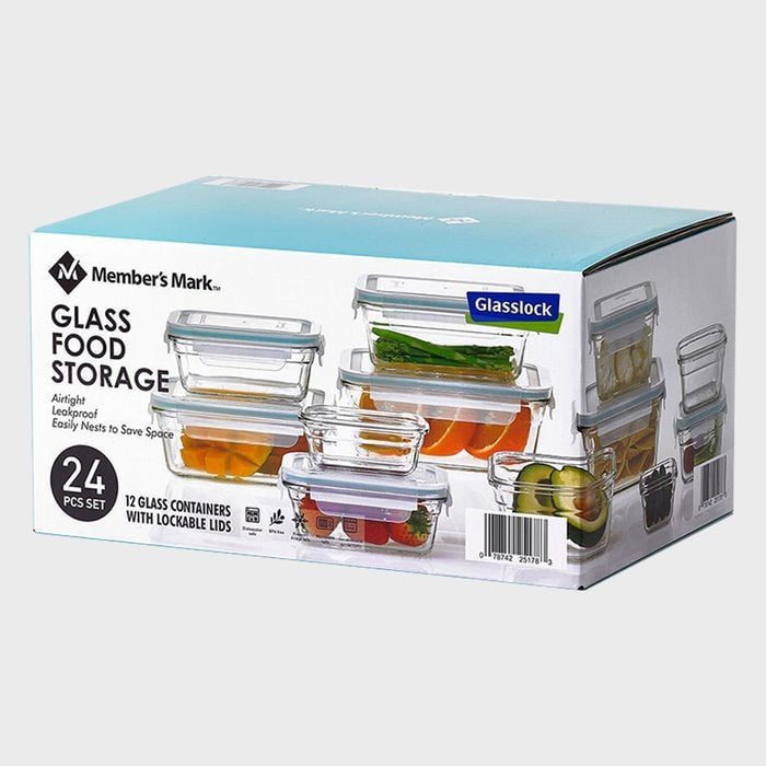 Box displaying glass food storage containers stacked with various foods, labeled 