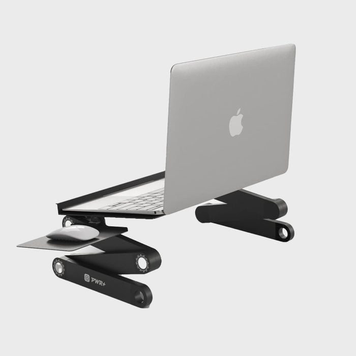 Laptop sits angled on an adjustable black stand with a separate mouse platform; minimalistic gray background provides a clean context.