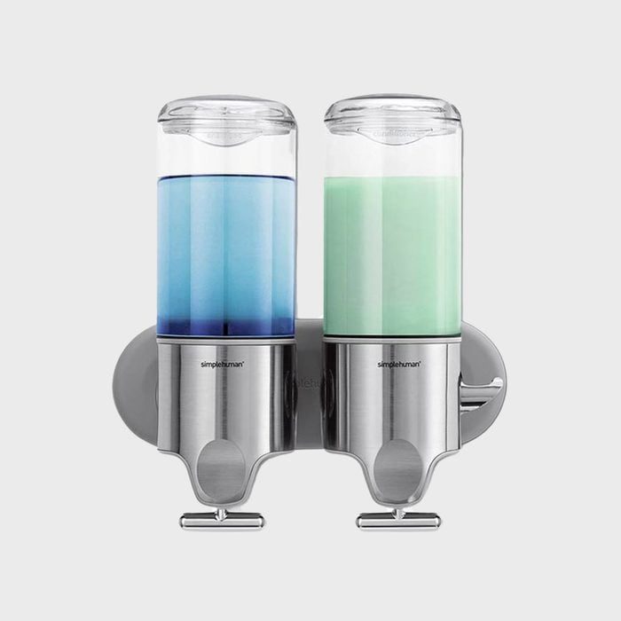 Dispenser holds blue and green liquid, mounted on a silver wall bracket; labeled 