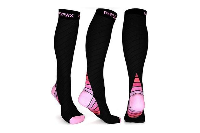 Black knee-high compression socks, featuring pink accents and 