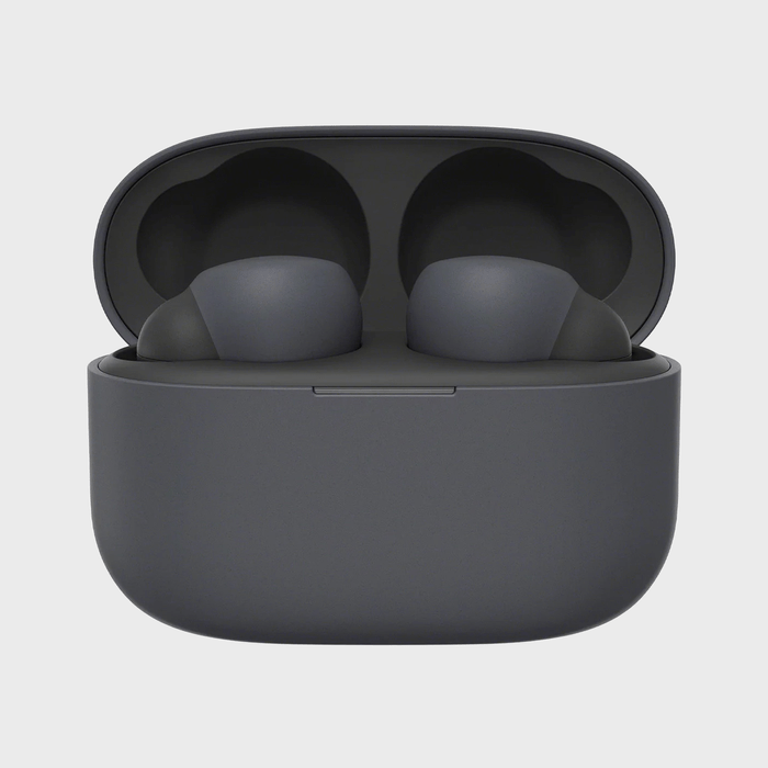 Gray wireless earbuds rest in an open charging case, against a plain white background.