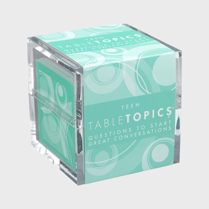 A clear cube contains green cards labeled 