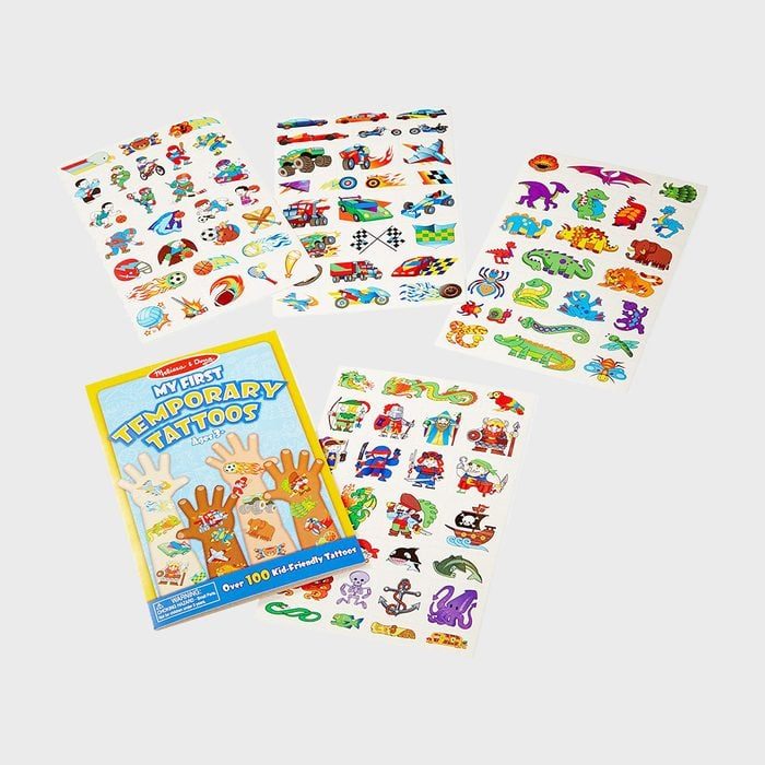 Temporary tattoo sheets display colorful playful designs, featuring animals and vehicles, surrounding a booklet titled 