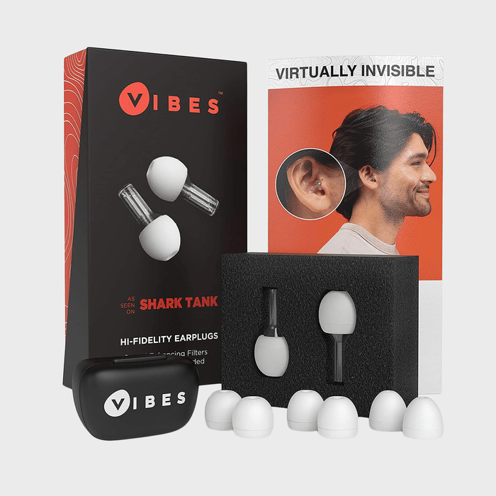 Earplugs displayed amid packaging and scattered tips, with a high-fidelity focus in an attractive retail setting, promoting 