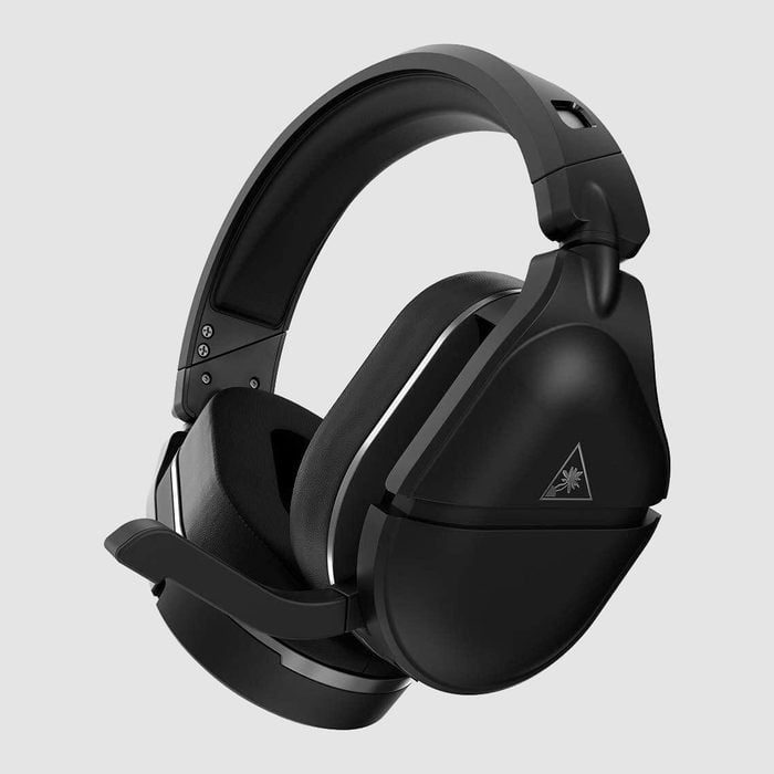 Black gaming headset with a microphone extended, set against a plain gray background, displaying a small triangular logo on the ear cup.