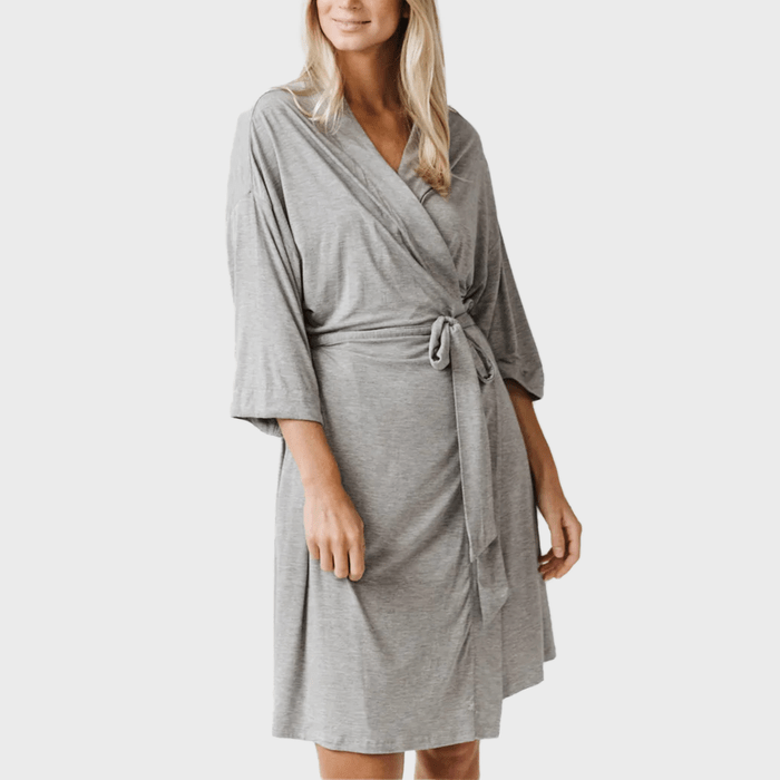 A person wears a gray robe tied at the waist, standing against a plain white background.