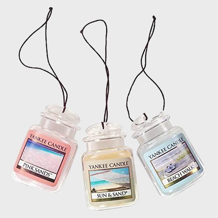 Three scented Yankee Candle car air fresheners hang vertically, labeled 