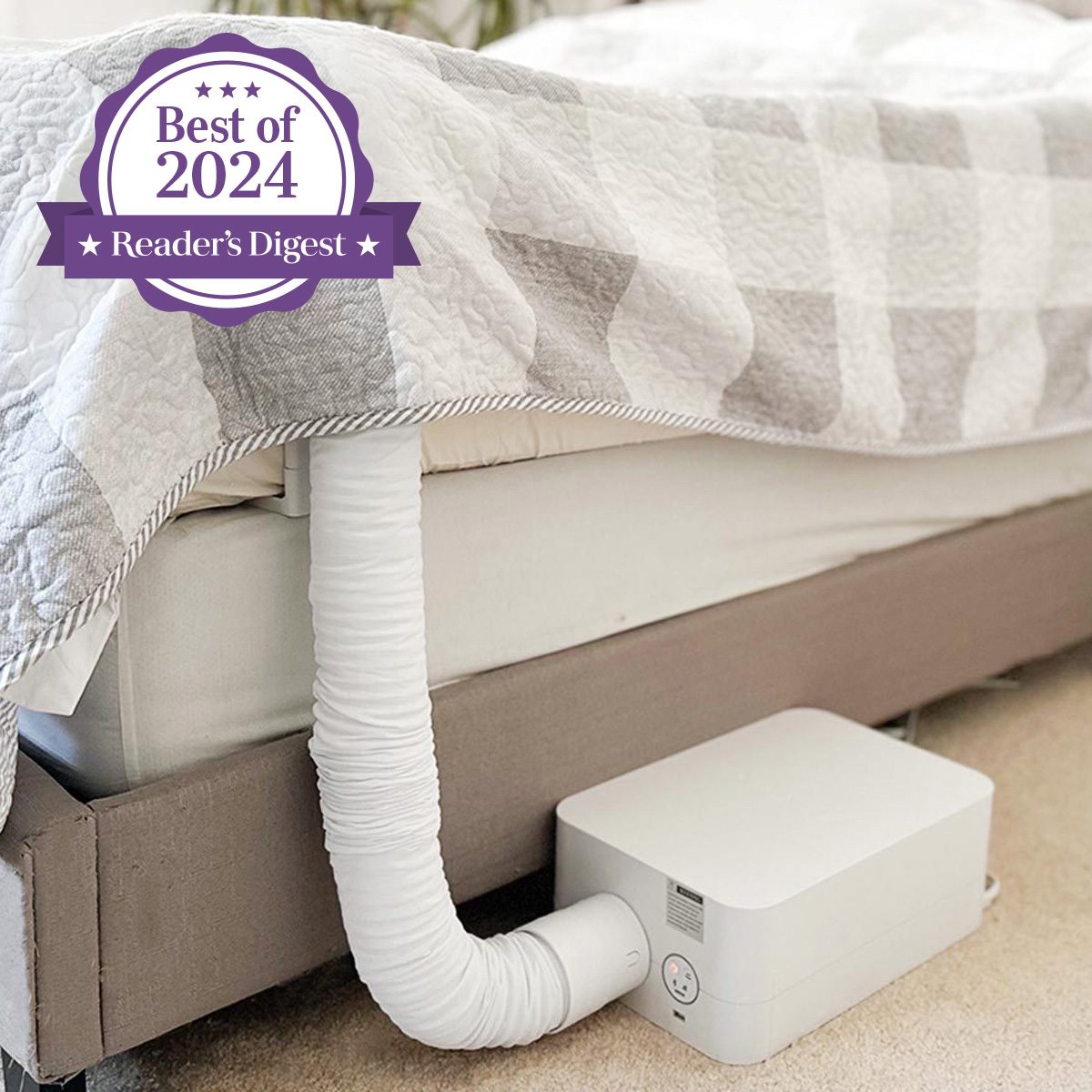Device connected to bed, circulating air under quilted blanket in a bedroom. Purple badge reads: "Best of 2024, Reader's Digest."