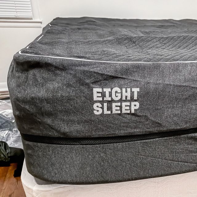 Mattress wrapped in dark fabric displays 
