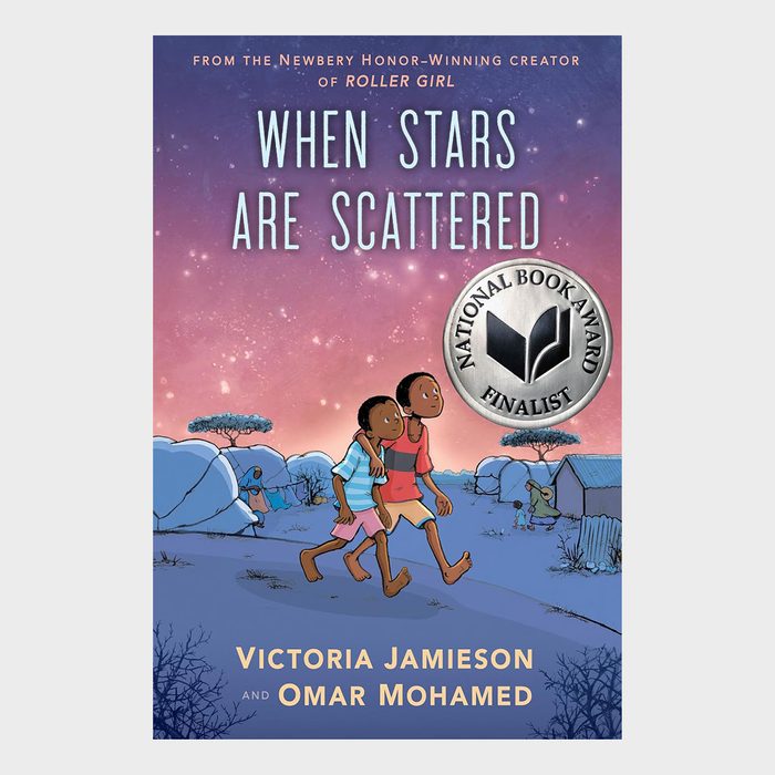 Two boys walk under a starry sky in a village, accompanied by hills and trees, showcasing a National Book Award finalist badge.