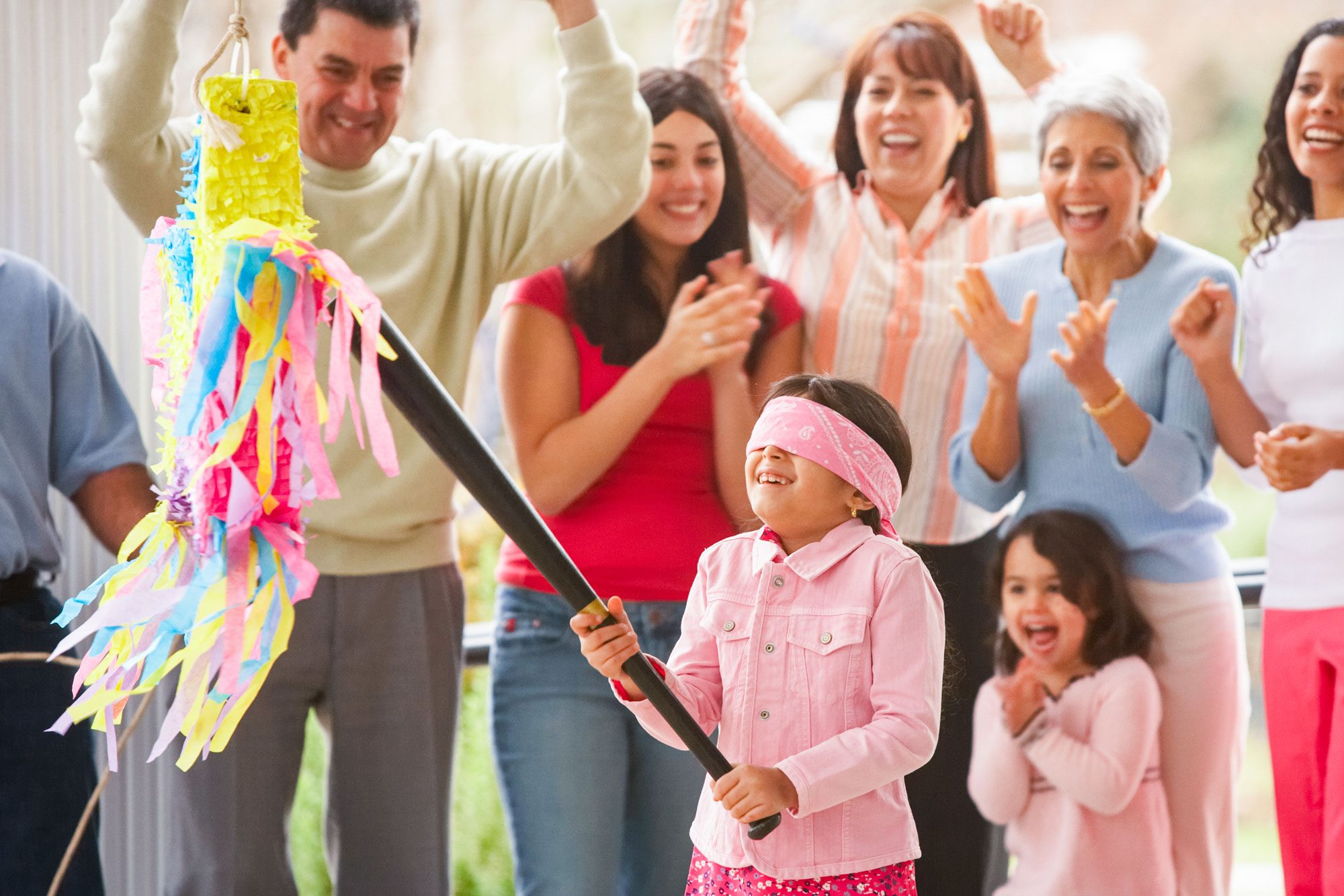 Girl Trying To Hit A Pinata