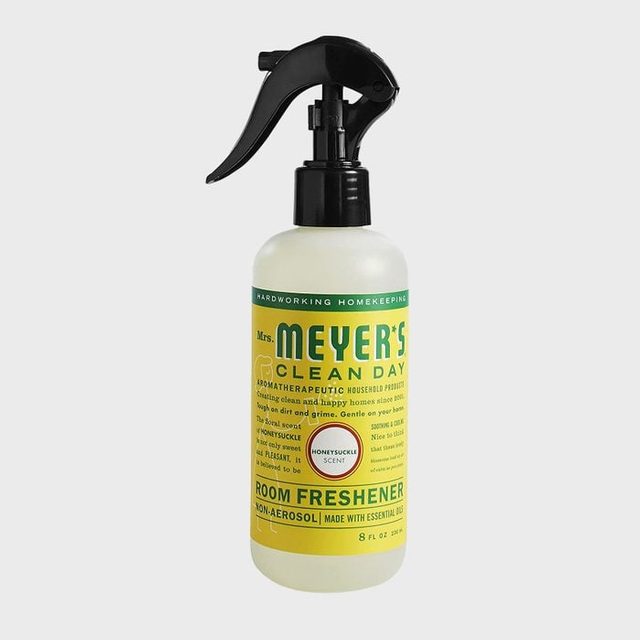 Spray bottle stands upright with a black trigger, labeled 