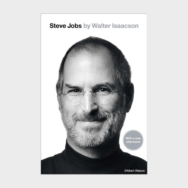 The book cover features a black-and-white photo of a smiling man with glasses, wearing a turtleneck. Text: 