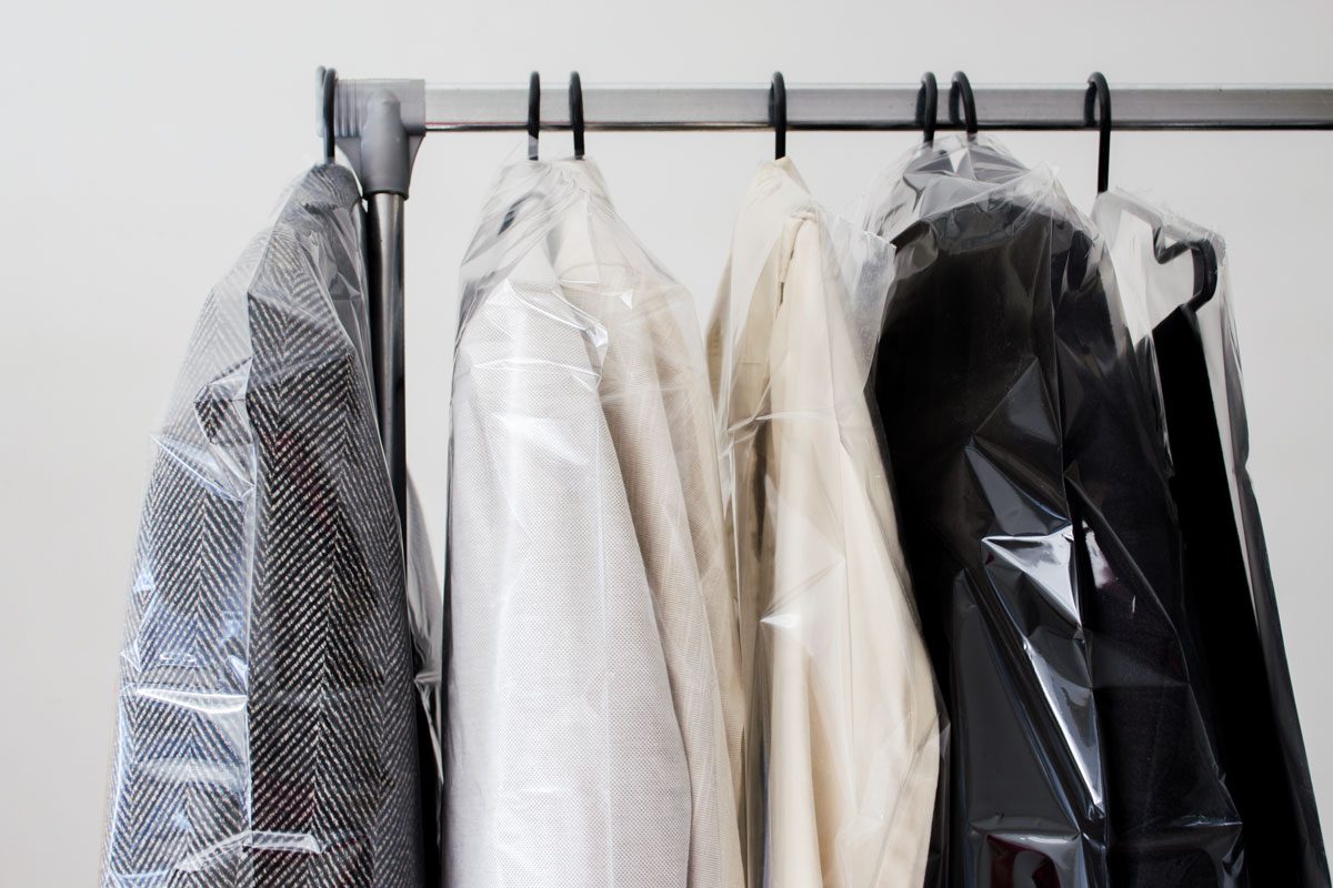 Dry cleaned clothes on rack