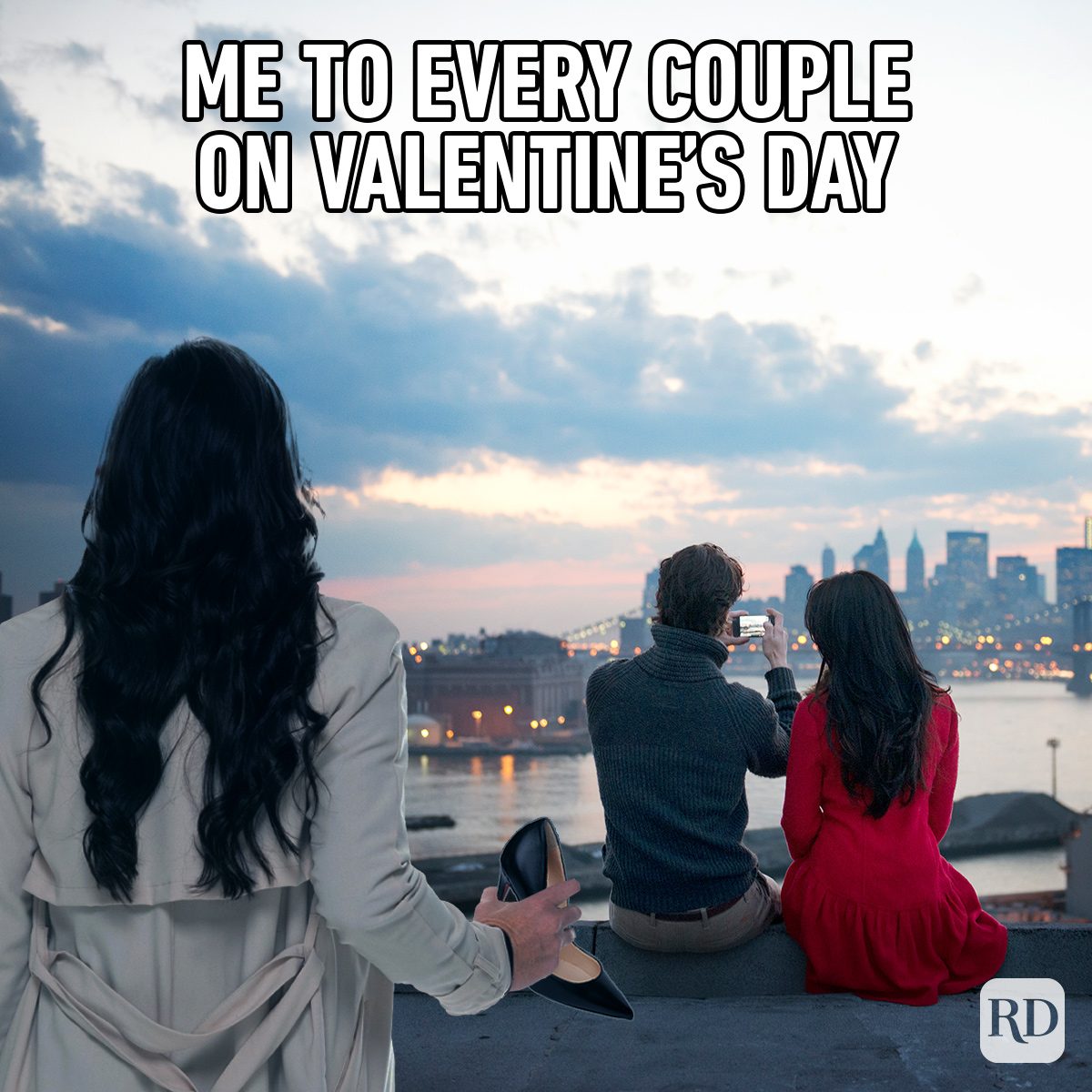 Funny Valentine’s Day Memes Everyone Can Relate To woman standing behind romantic couple at sunset holding a stiletto