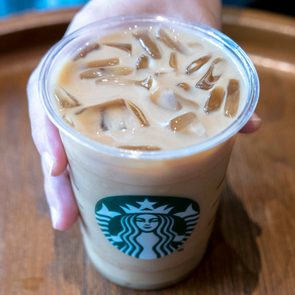 Cup of Starbucks iced coffee with the green Starbucks logo on the front