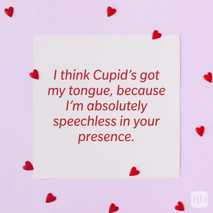 Valentine’s Day Pickup Line on paper background with scattered hearts around it background