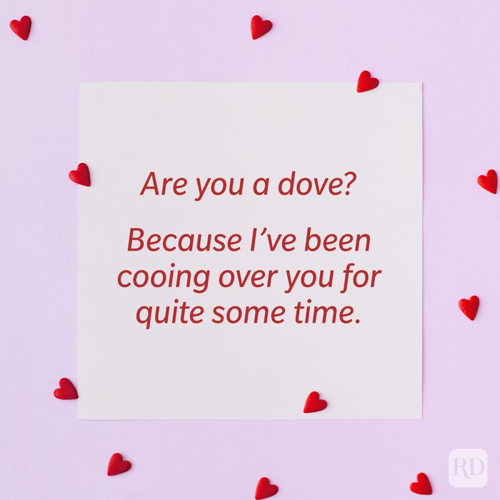 Valentine’s Day Pickup Line on paper background with scattered hearts around it background