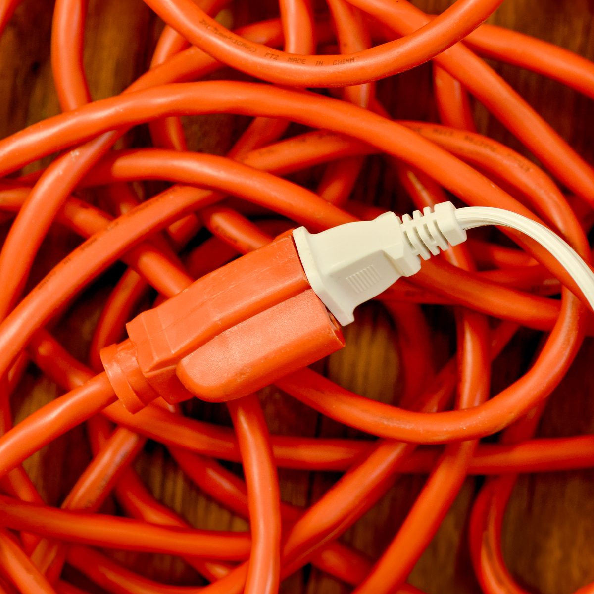 Electrical Cord Plugged Into Orange Extension Cord