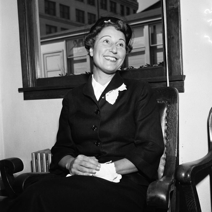 Historical image of Margaret Herrick, Academy librarian, sitting on a chair