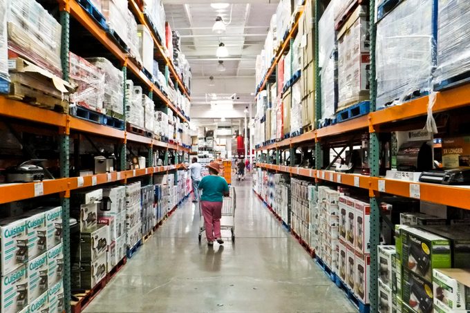 Person shopping in an aisle at Costco