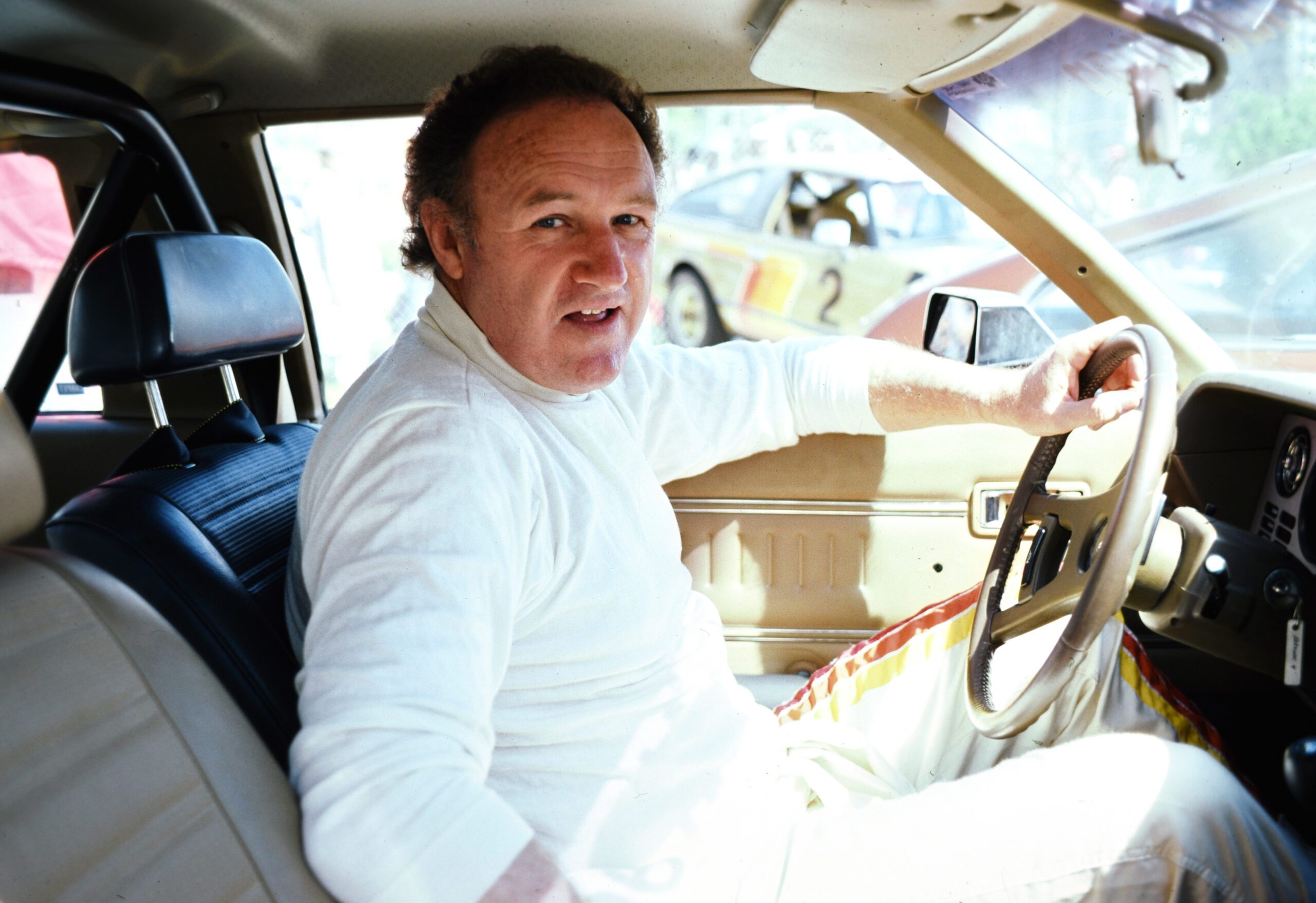 Gene Hackman driving a car