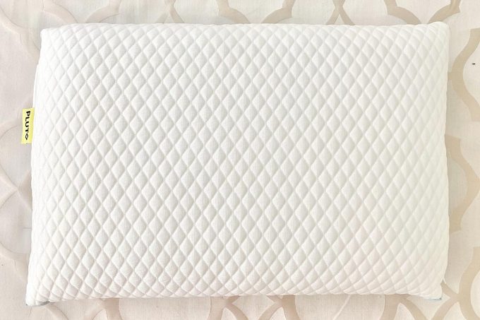 Pluto Pillow lying on bed