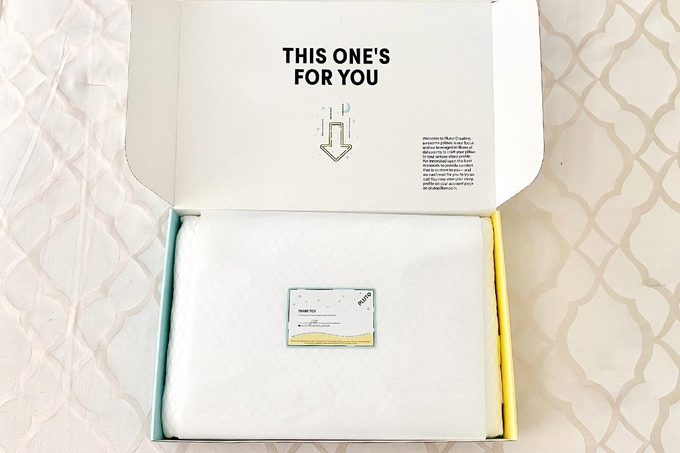 Pluto Pillow packaging being unboxed.
