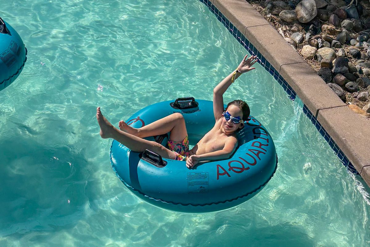 kid in swimming pool in ring floater