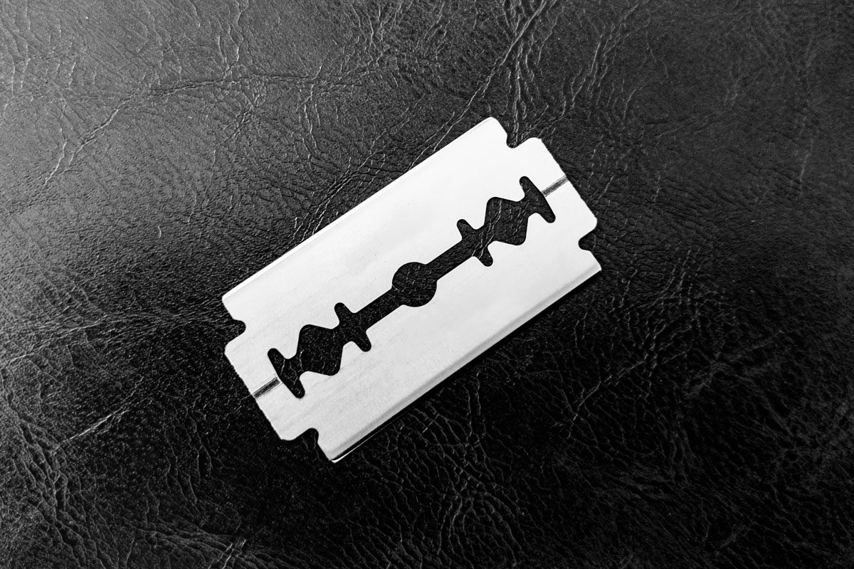 Stainless Steel Blade Isolated On Textured Background