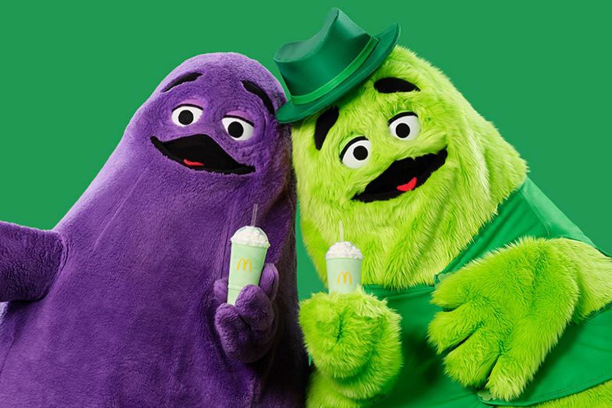Grimace (left) and Uncle O'Grimacey (right) in front of a green background