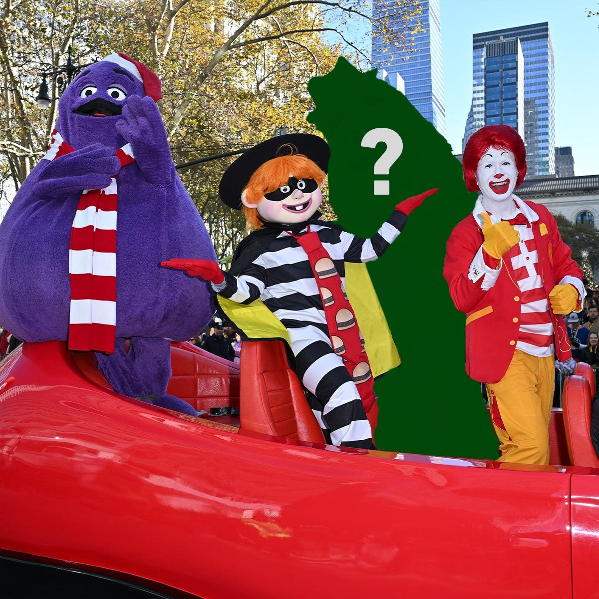 Grimace, Hamburglar, a mystery green character, and Ronald McDonald in a red car