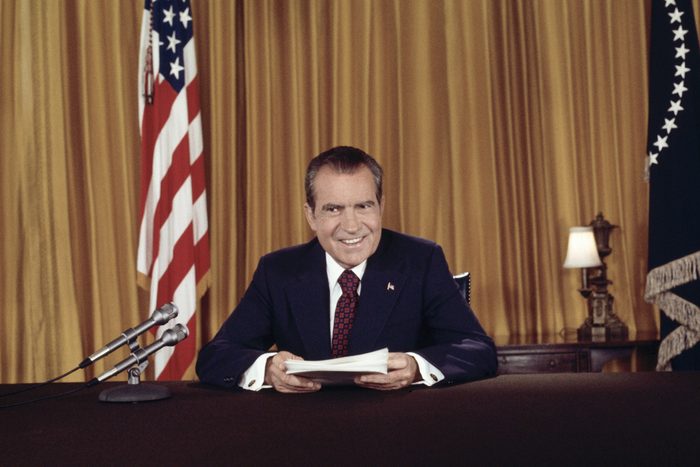 Richard Nixon poses for still photographs after a televised address