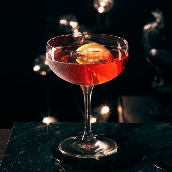 A Gin Dubonnet against a dark background