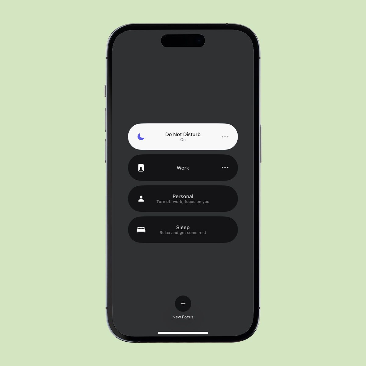 A smartphone screen displaying a "Do Not Disturb" mode with three focus options: Work, Personal, and Sleep. The background is mint green, and the phone screen is predominantly dark.